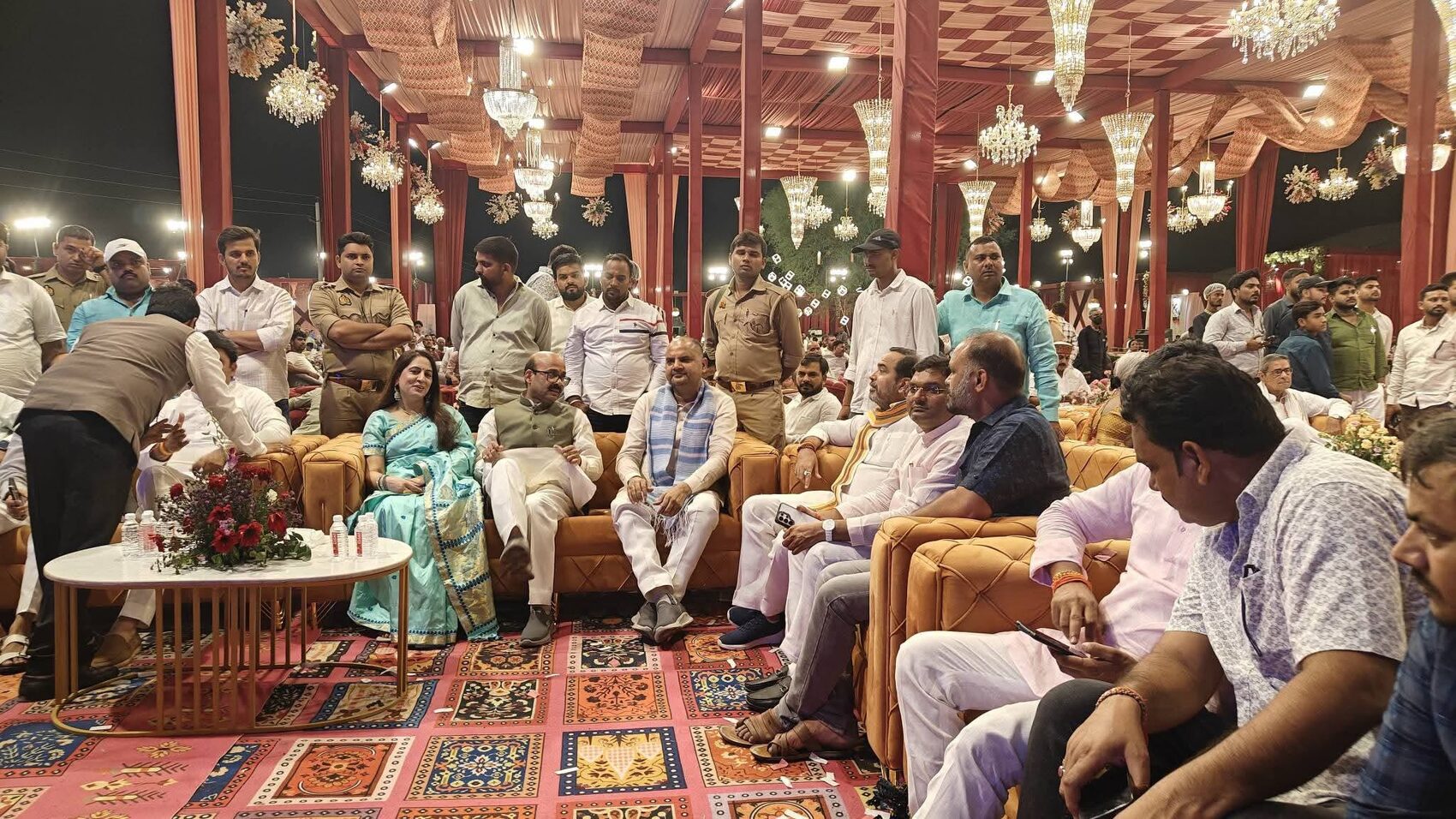 A large indoor public gathering attended by Harish Dwivedi and community members
